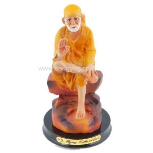 Sai Baba Yellow Clothing Sitting With Round Black Base